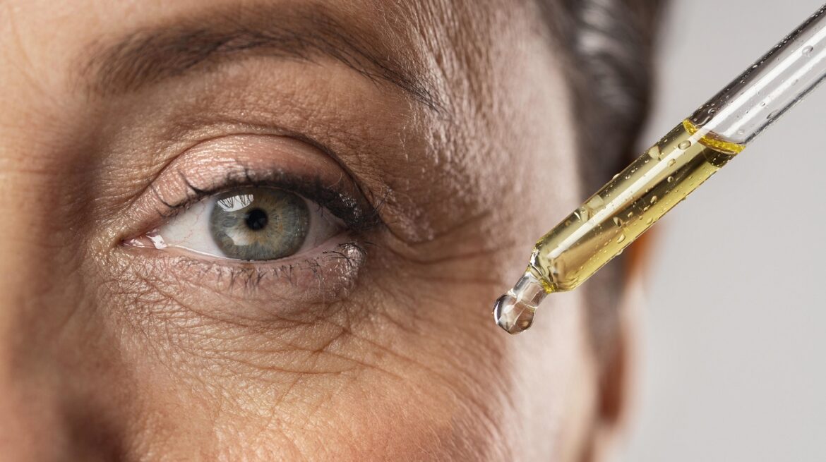 elder-woman-using-serum-her-eye-wrinkles